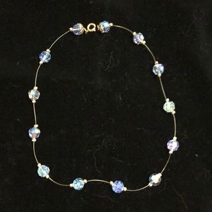 Vintage invisible Necklace-blue iridescent beads.